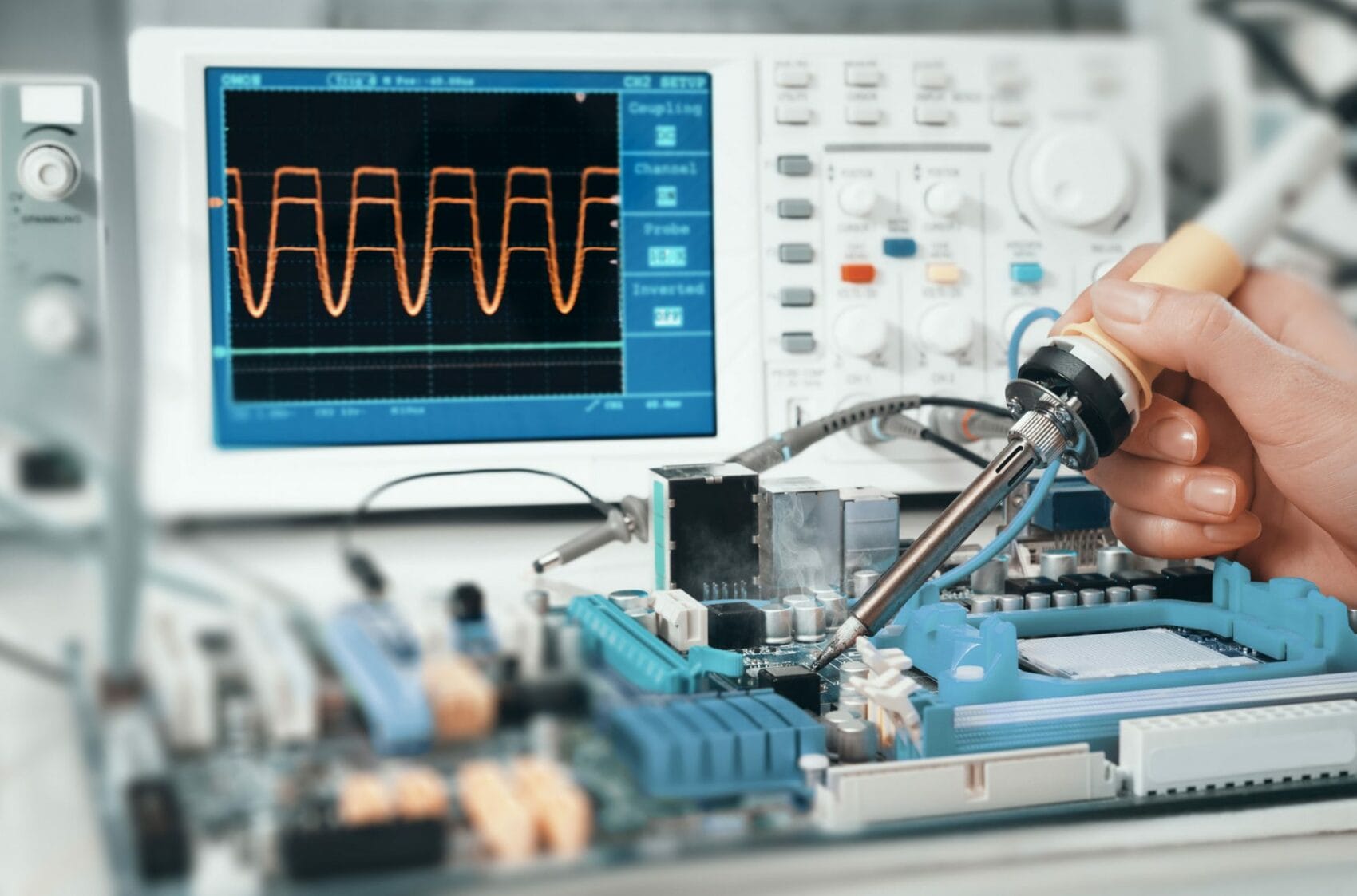 electroinics-equipment-repair 3 Motherboard being repaired with soldering iron