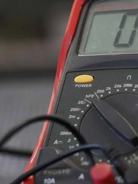 Digital multimeter used to verify test equipment compliance during an electrical inspection