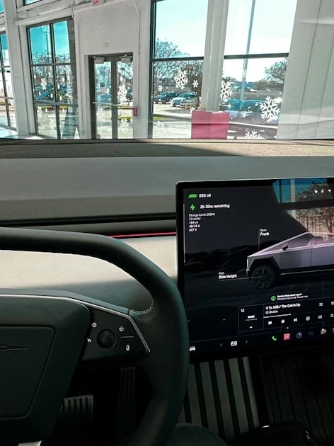 Laptop connected on a vehicle dashboard during diagnostic scanning, the pre- and post-scan step required before ADAS calibration