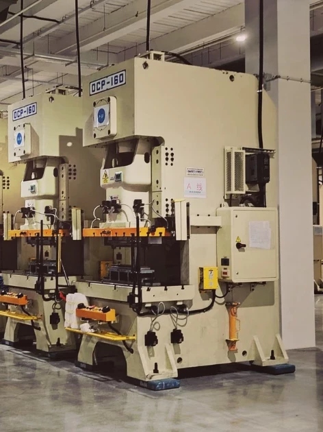 Rows of industrial manufacturing machinery on a factory floor that depend on NIST-traceable load cell calibration to keep force measurements accurate